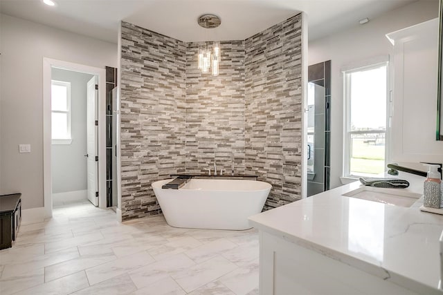 720 Glade Park Ct, Azle, TX 76020 - bathroom featuring vanity, a freestanding bath, a chandelier, marble finish floors, and tiled shower