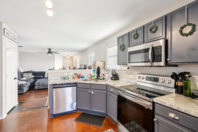 6724 Meadow Way Ln, Fort Worth, TX 76179 - kitchen with appliances with stainless steel finishes, a peninsula, finished concrete flooring, light countertops, and open floor plan