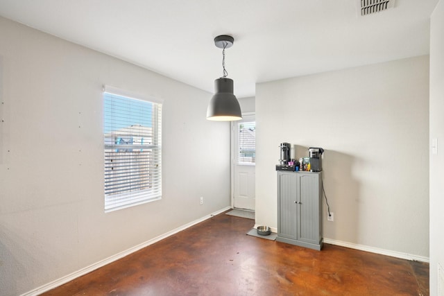 6724 Meadow Way Ln, Fort Worth, TX 76179 - unfurnished dining area with finished concrete flooring and baseboards