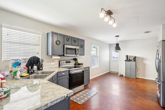 6724 Meadow Way Ln, Fort Worth, TX 76179 - kitchen featuring appliances with stainless steel finishes, finished concrete flooring, light countertops, decorative light fixtures, and gray cabinets