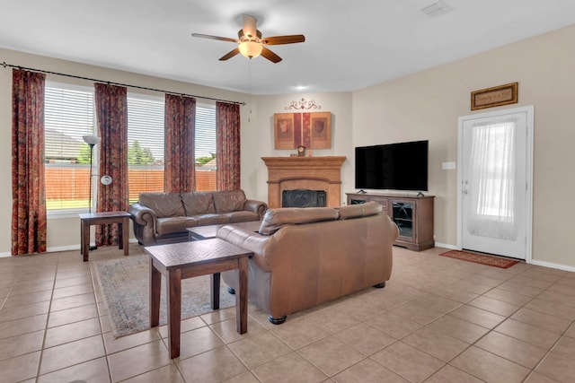 5233 Scenic Point Dr, Fort Worth, TX 76244 - living room with a fireplace, a ceiling fan, light tile patterned flooring, and healthy amount of natural light