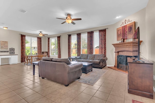 5233 Scenic Point Dr, Fort Worth, TX 76244 - living room featuring ceiling fan, light tile patterned floors, and a fireplace with raised hearth