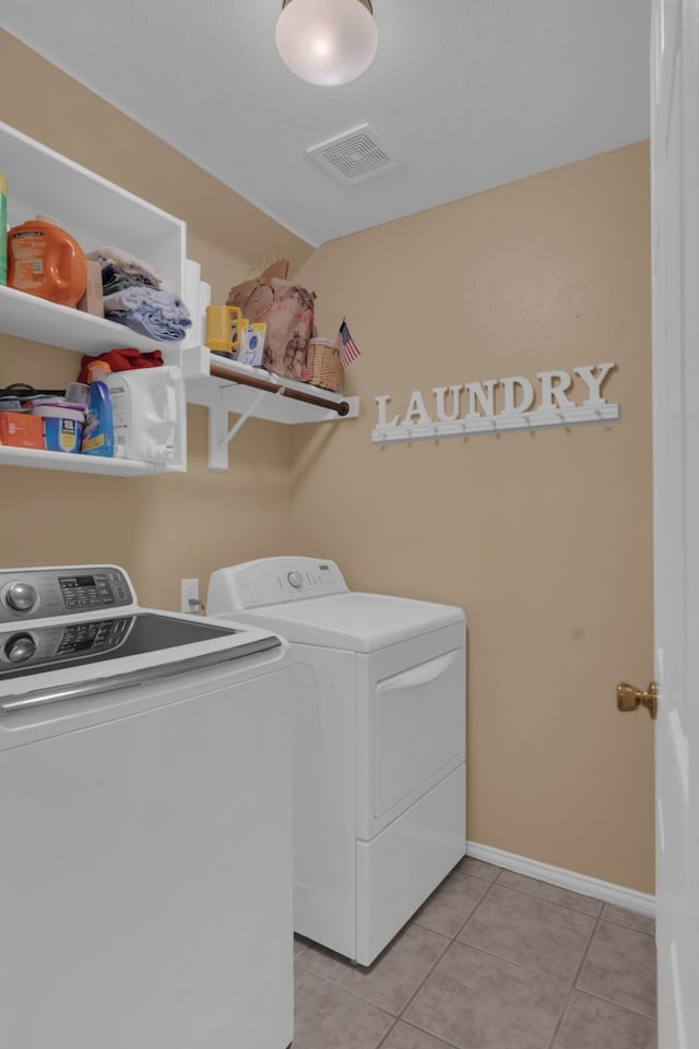 5233 Scenic Point Dr, Fort Worth, TX 76244 - washroom with washing machine and dryer and light tile patterned floors
