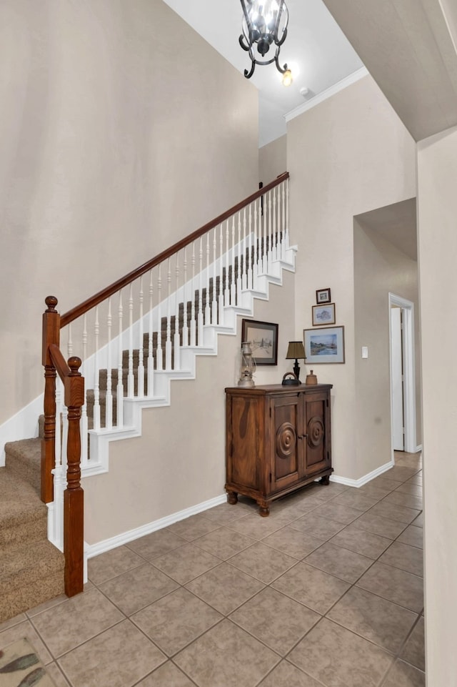 5233 Scenic Point Dr, Fort Worth, TX 76244 - stairway with a high ceiling, tile patterned floors, a chandelier, and ornamental molding