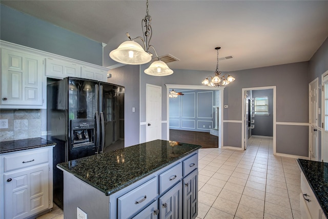 1015 Midnight Pass, Rockwall, TX 75087 - kitchen featuring white cabinets, backsplash, a ceiling fan, a center island, and decorative light fixtures
