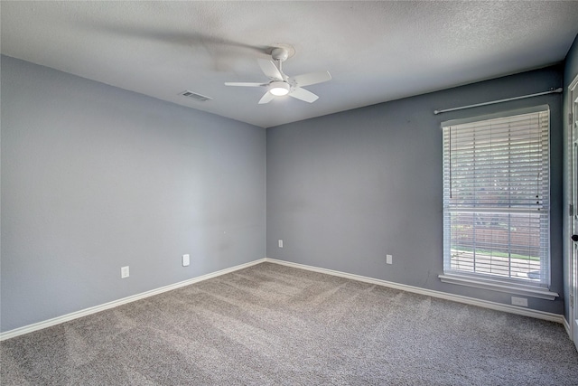 1015 Midnight Pass, Rockwall, TX 75087 - empty room with ceiling fan, carpet, and a textured ceiling