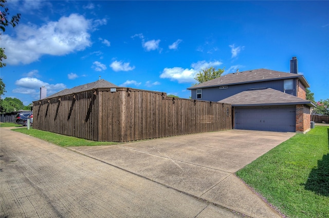 1015 Midnight Pass, Rockwall, TX 75087 - view of side of home with concrete driveway, an attached garage, roof with shingles, brick siding, and a chimney