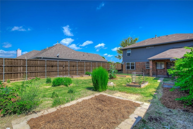 1015 Midnight Pass, Rockwall, TX 75087 - fenced backyard featuring a vegetable garden
