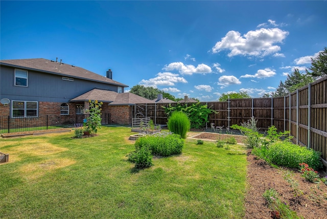 1015 Midnight Pass, Rockwall, TX 75087 - fenced backyard with a garden