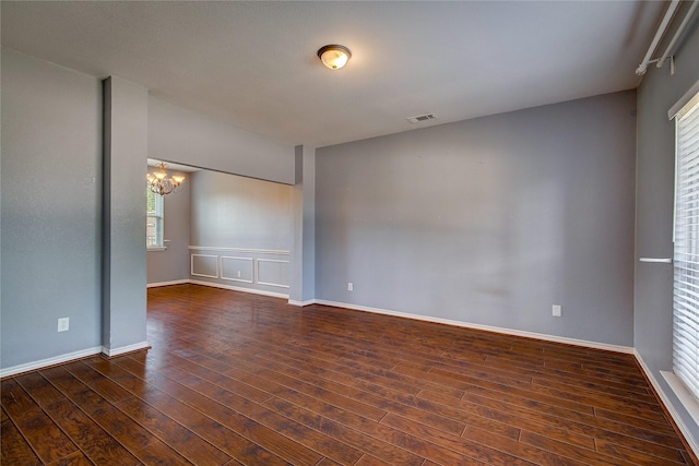 1015 Midnight Pass, Rockwall, TX 75087 - empty room featuring a chandelier and wood finished floors
