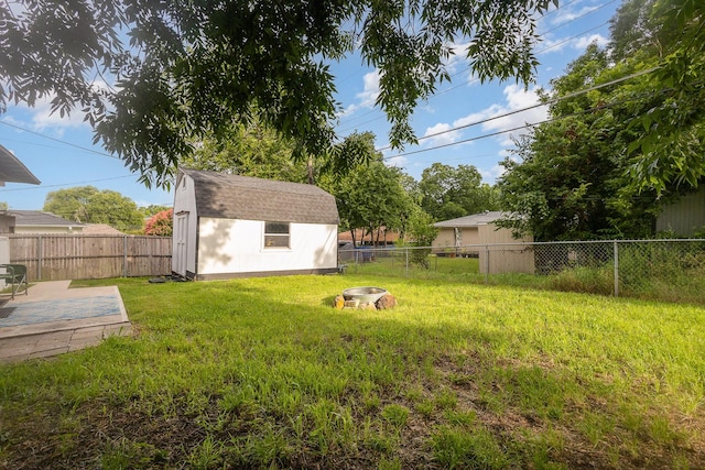 621 New Market Rd, Mesquite, TX 75149 - fenced backyard with an outdoor fire pit and a storage unit