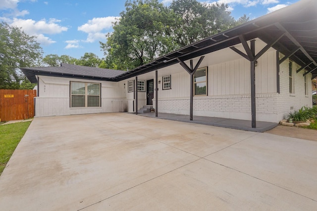 621 New Market Rd, Mesquite, TX 75149 - back of house featuring brick siding and driveway