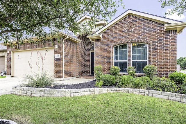 2600 Canyon Wren Ln, Fort Worth, TX 76244 - view of front of house featuring concrete driveway, brick siding, a garage, and a front yard