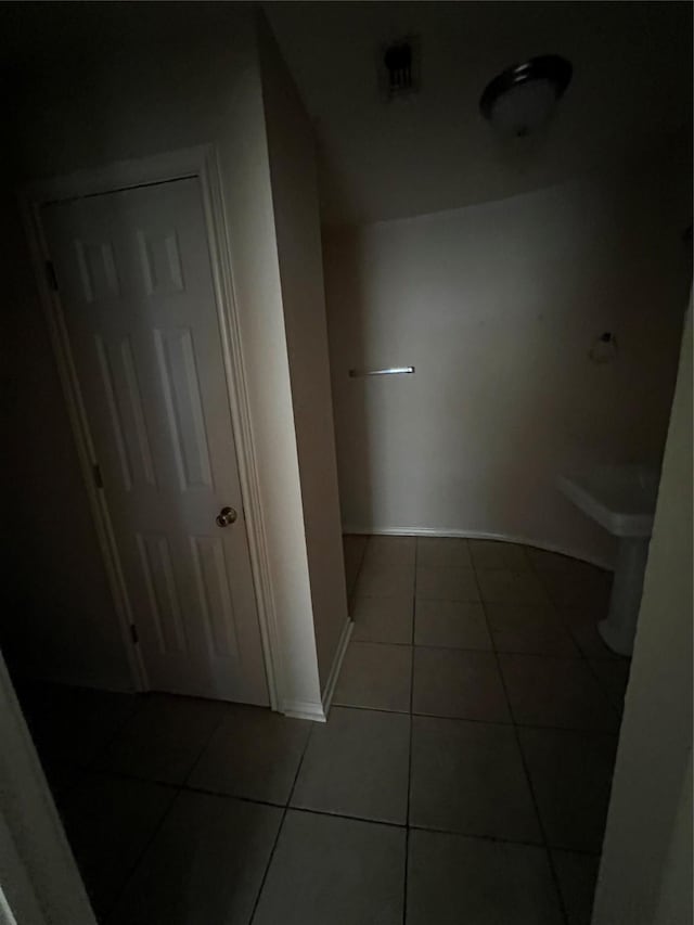 710 W Main St, Denison, TX 75020 - hall featuring tile patterned flooring and baseboards