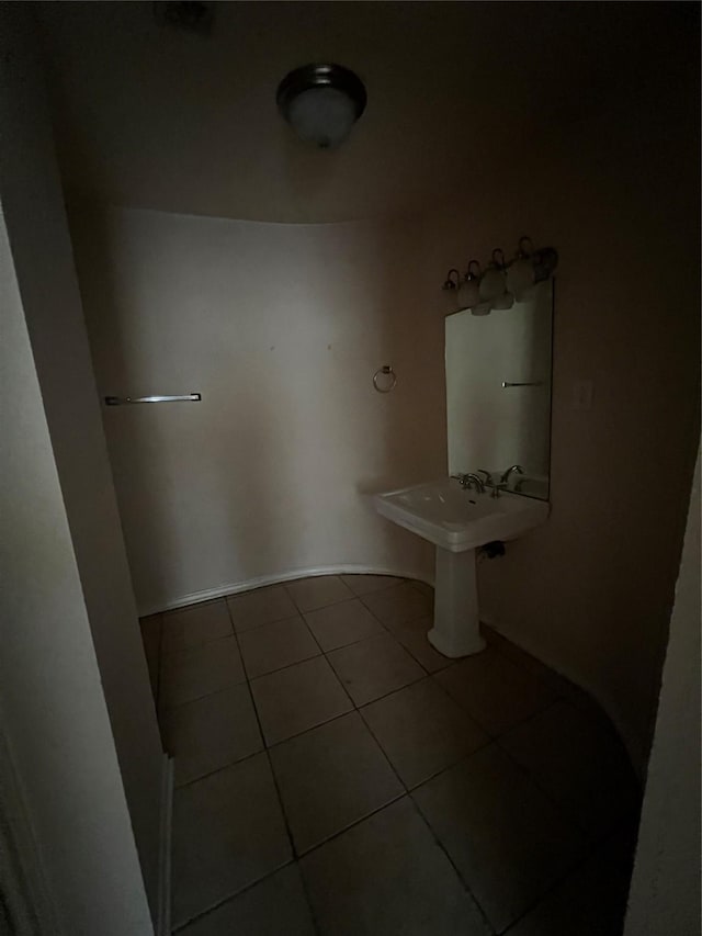 710 W Main St, Denison, TX 75020 - bathroom with tile patterned flooring and baseboards