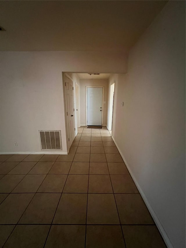 710 W Main St, Denison, TX 75020 - hall featuring tile patterned flooring and baseboards