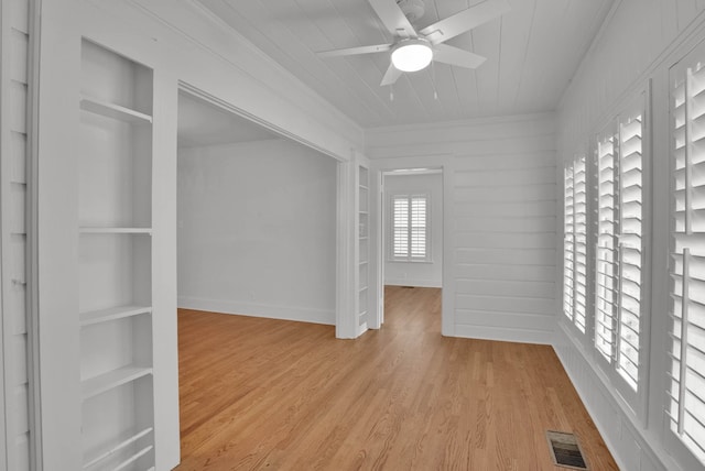 473 Albany Ave, Shreveport, LA 71105 - empty room with built in shelves, a ceiling fan, light wood-style flooring, and crown molding