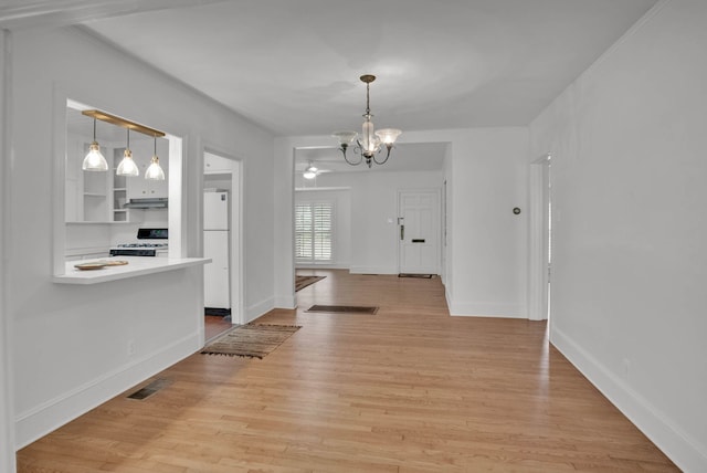473 Albany Ave, Shreveport, LA 71105 - unfurnished dining area with a chandelier and light wood finished floors