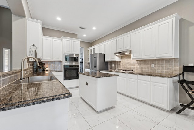 4105 Tree House Ln, Corinth, TX 76208 - kitchen with stainless steel appliances, crown molding, backsplash, under cabinet range hood, and a center island