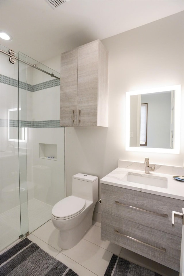 548 Oak Grove Ln, Coppell, TX 75019 - bathroom with vanity, a shower stall, and tile patterned flooring