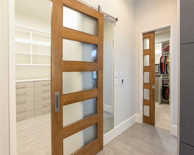 548 Oak Grove Ln, Coppell, TX 75019 - corridor with a barn door and baseboards