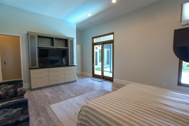 548 Oak Grove Ln, Coppell, TX 75019 - bedroom with access to exterior, light wood-style flooring, and recessed lighting