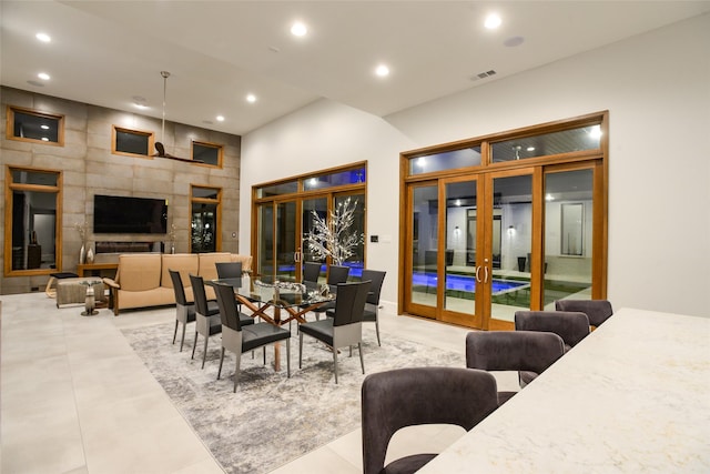 548 Oak Grove Ln, Coppell, TX 75019 - dining area featuring french doors, recessed lighting, and a towering ceiling