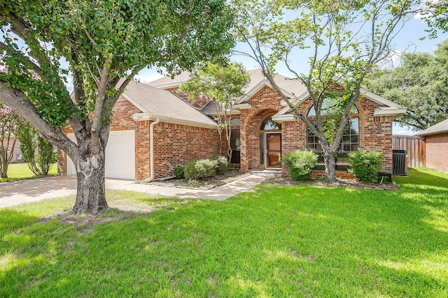 4307 Foxborough Trl, Arlington, TX 76001 - view of front of property featuring brick siding, a front yard, driveway, and a garage