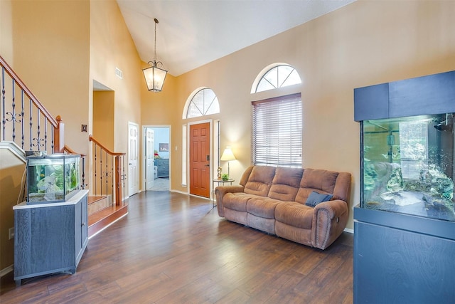 4307 Foxborough Trl, Arlington, TX 76001 - living area with high vaulted ceiling, stairs, and dark wood finished floors