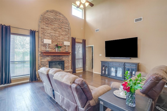 4307 Foxborough Trl, Arlington, TX 76001 - living room with a ceiling fan, a towering ceiling, wood finished floors, and a fireplace