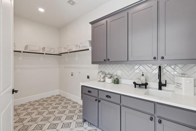 4400 Honeyvine Ln, Prosper, TX 75078 - laundry area featuring electric dryer hookup, hookup for a washing machine, cabinet space, and recessed lighting
