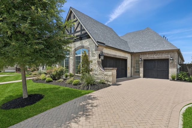 4400 Honeyvine Ln, Prosper, TX 75078 - view of front of property with an attached garage, decorative driveway, a front lawn, brick siding, and stone siding