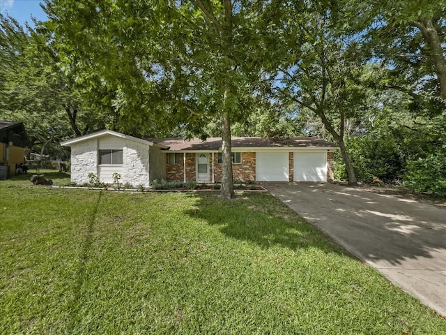 202 E Rentz St, Weatherford, TX 76086 - view of front of house featuring an attached garage, concrete driveway, a front lawn, and stone siding