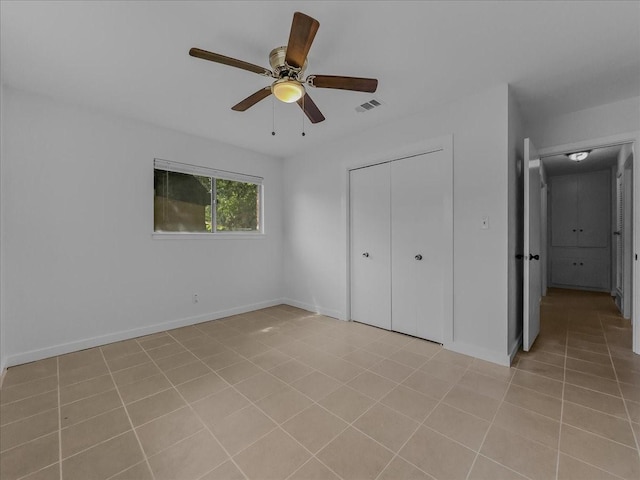 202 E Rentz St, Weatherford, TX 76086 - unfurnished bedroom with light tile patterned flooring, a closet, and ceiling fan