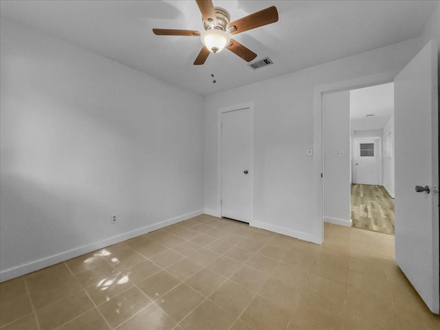 202 E Rentz St, Weatherford, TX 76086 - unfurnished bedroom featuring baseboards and ceiling fan