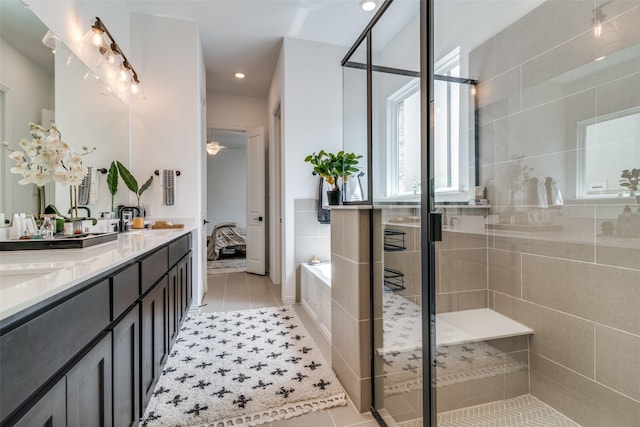 5511 Grand Ave, Sachse, TX 75048 - ensuite bathroom with tile patterned floors, double vanity, a bath, a shower stall, and recessed lighting