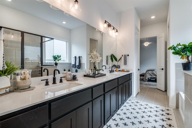 5511 Grand Ave, Sachse, TX 75048 - ensuite bathroom featuring double vanity, tile patterned floors, tiled shower, ceiling fan, and recessed lighting