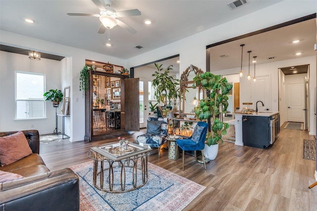 5511 Grand Ave, Sachse, TX 75048 - living room featuring wood finished floors, a ceiling fan, and recessed lighting
