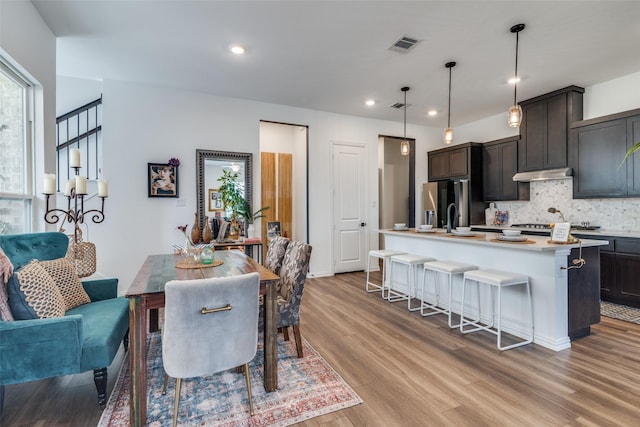5511 Grand Ave, Sachse, TX 75048 - dining space featuring wood finished floors and recessed lighting