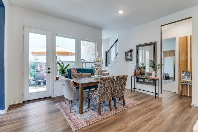 5511 Grand Ave, Sachse, TX 75048 - dining area featuring wood finished floors, stairs, and recessed lighting