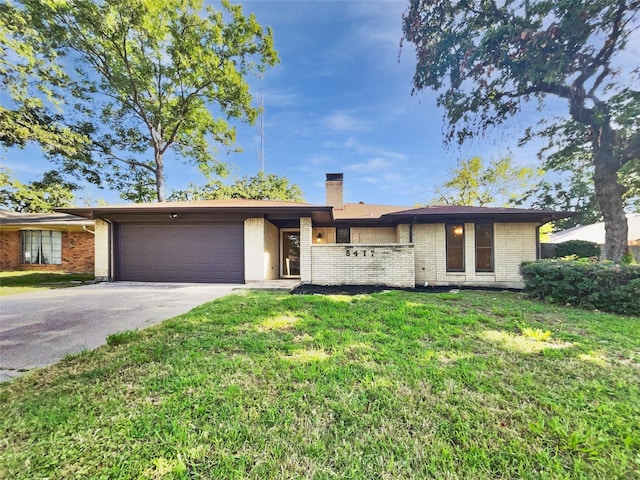 5417 Grissom Dr, Arlington, TX 76016 - single story home featuring brick siding, an attached garage, driveway, and a chimney