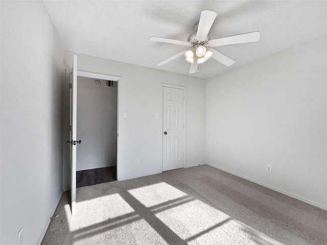 5417 Grissom Dr, Arlington, TX 76016 - unfurnished bedroom featuring carpet floors, ceiling fan, and a textured ceiling