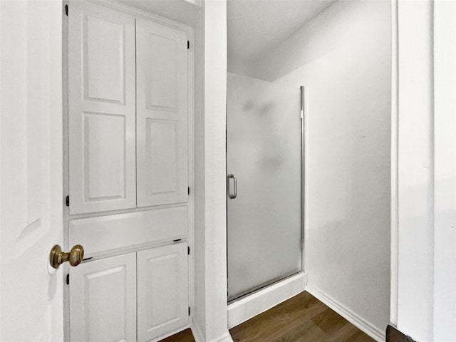 5417 Grissom Dr, Arlington, TX 76016 - bathroom featuring a stall shower and wood finished floors