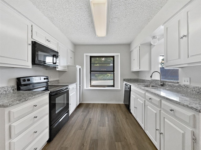 5417 Grissom Dr, Arlington, TX 76016 - kitchen with black appliances, white cabinetry, a textured ceiling, dark wood-style flooring, and light stone countertops