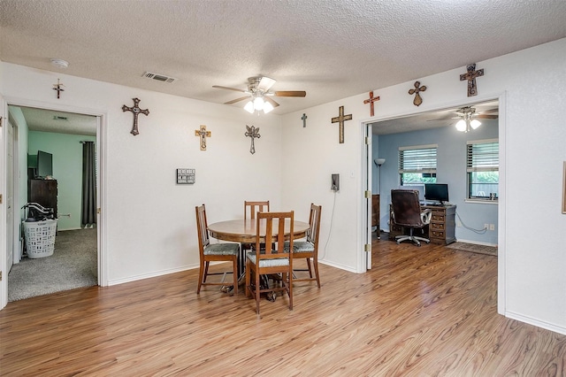 321 E Hampton Rd, Crowley, TX 76036 - dining room featuring a ceiling fan, light wood finished floors, an office area, and a textured ceiling