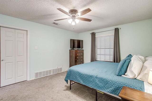 321 E Hampton Rd, Crowley, TX 76036 - carpeted bedroom with a ceiling fan and a textured ceiling