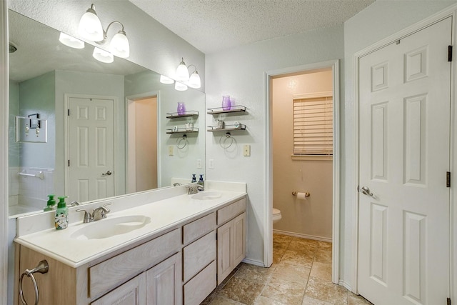 321 E Hampton Rd, Crowley, TX 76036 - bathroom with double vanity and a textured ceiling