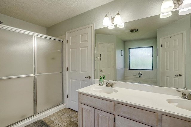 321 E Hampton Rd, Crowley, TX 76036 - full bathroom featuring double vanity, a stall shower, and a textured ceiling
