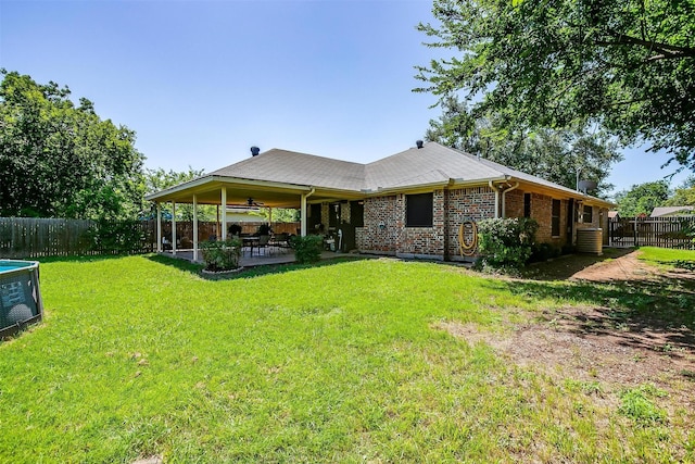 321 E Hampton Rd, Crowley, TX 76036 - back of property featuring a fenced backyard, a patio, brick siding, and a ceiling fan