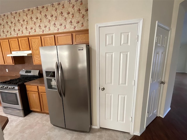 939 Clear Creek Dr, Mesquite, TX 75181 - kitchen featuring appliances with stainless steel finishes, under cabinet range hood, and brown cabinets